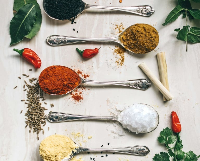 a variety of spices and spices in spoons and spoons