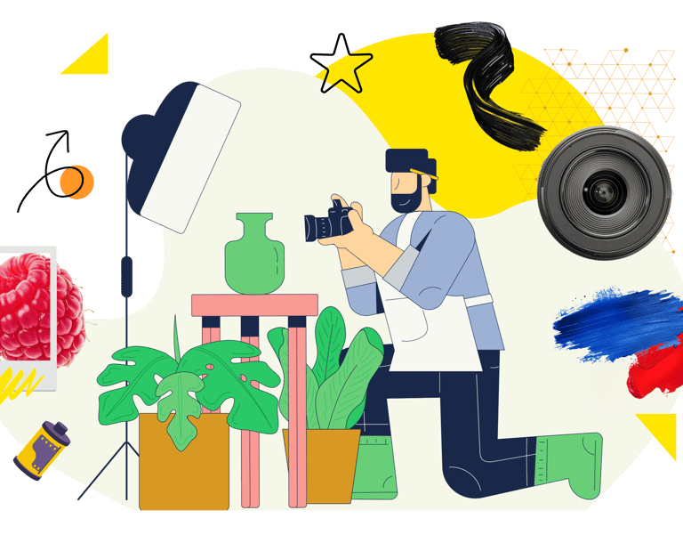 Professional photographer using a digital camera for studio product photography and artistic content creation.