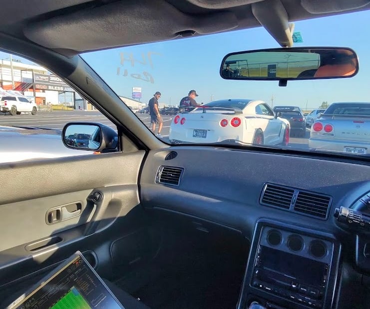 a car driving down a highway with a laptop computer