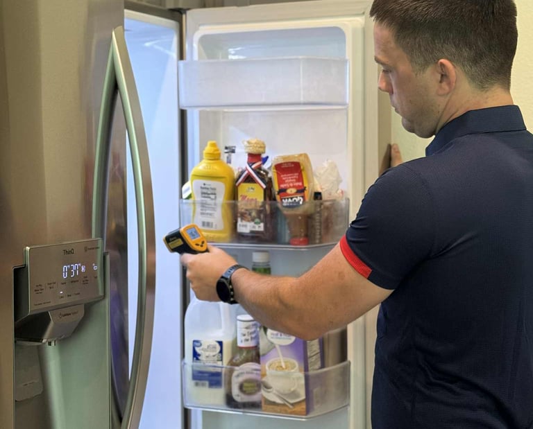 Jacksonville appliance repair technician checking refrigerator temperature