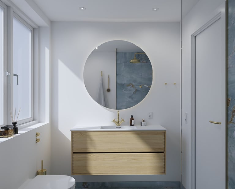 Modern bathroom with a light wood floating vanity, round backlit mirror, and gold fixtures.