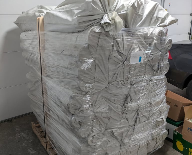 A massive stack of tree tubes over 6 feet tall