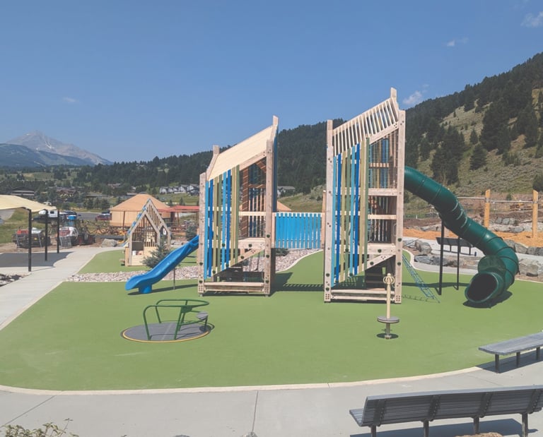 a playground with a slider and a slider