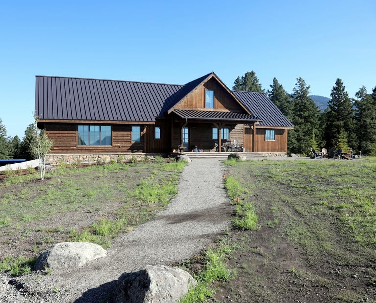 a house with a brown metal roof and a brown metal roof