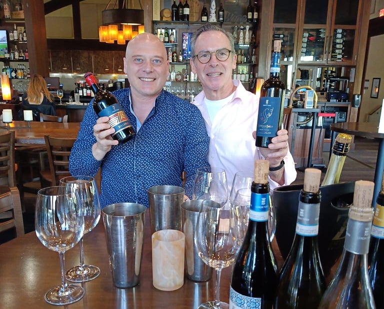 wine professional and wine producer showcasing their newly imported selections