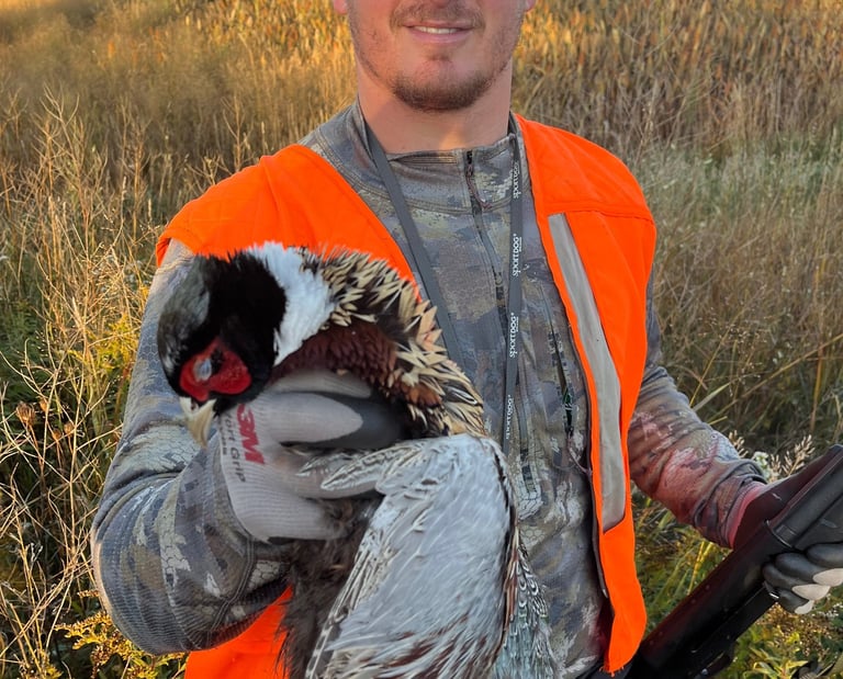 Boss Pressure Washing LLC owner Torsten Boss wearing blaze orange hunting gear outdoors