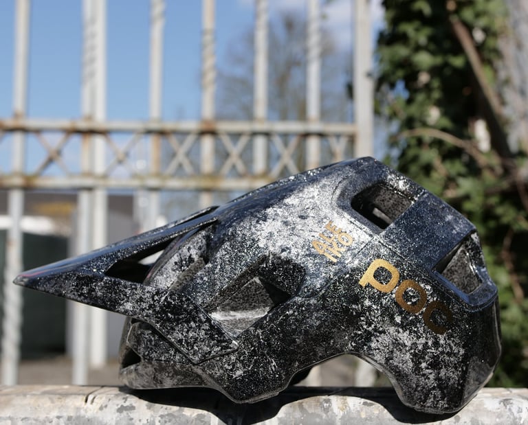 a MTB POC Helmet customized with marbling effect and gold