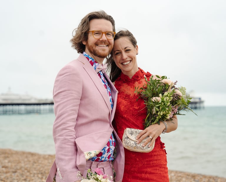 Brighton beach wedding couple smiling with bouquet, Brighton and Hove wedding photographer