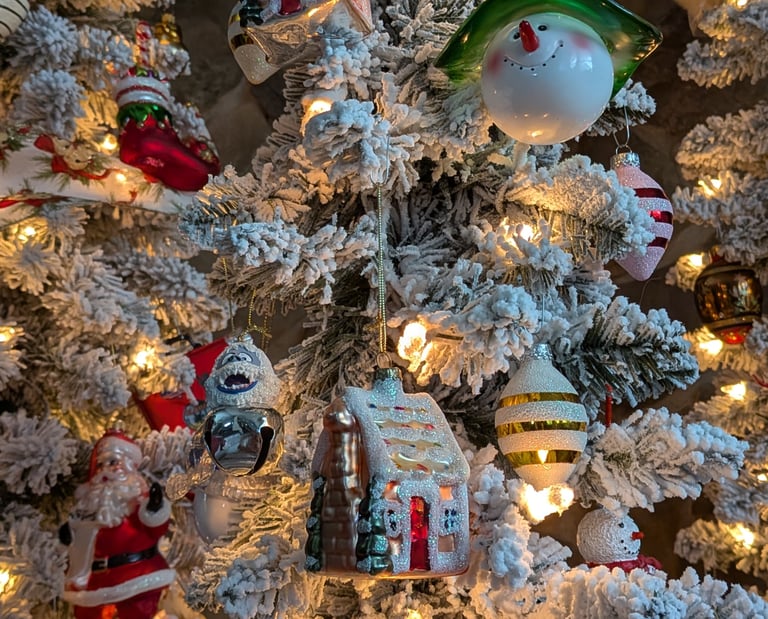 Close-up of decorated holiday tree with ornaments used for seasonal home and garden styling.