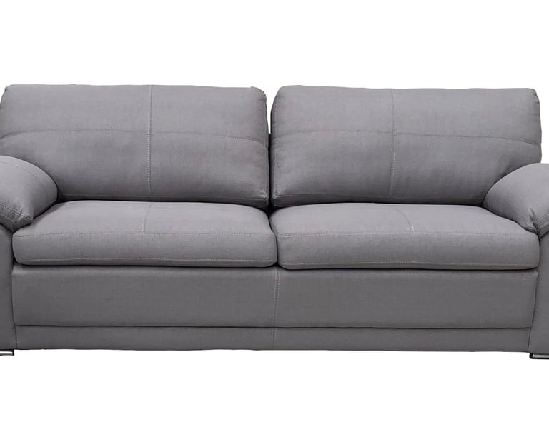 a grey couch with pillows and pillows on it