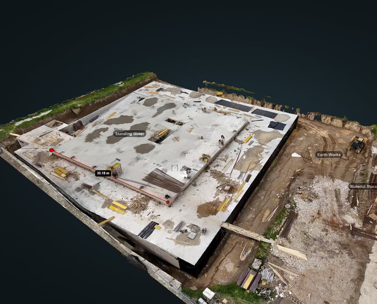 Aerial orthomosaic of an active construction site — concrete slab pour stage with progress monitorin