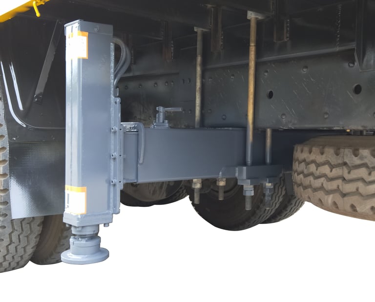 Truck's backside featuring steel plate and rear outriggers for crane support.