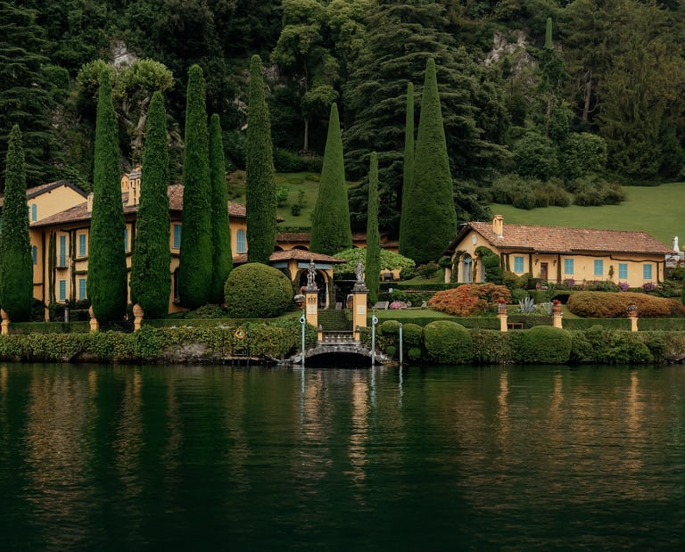 a house with a bridge over a lake como