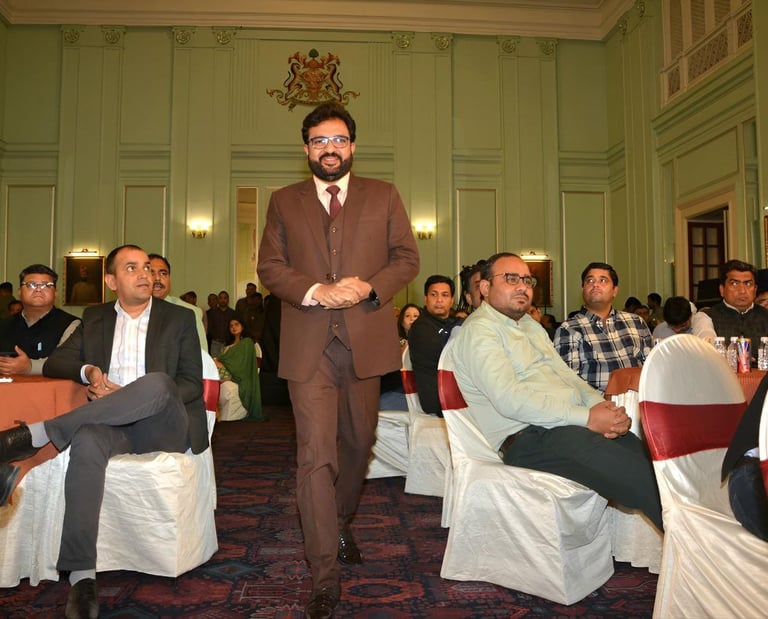 Speaker addressing an engaged audience at a formal event.