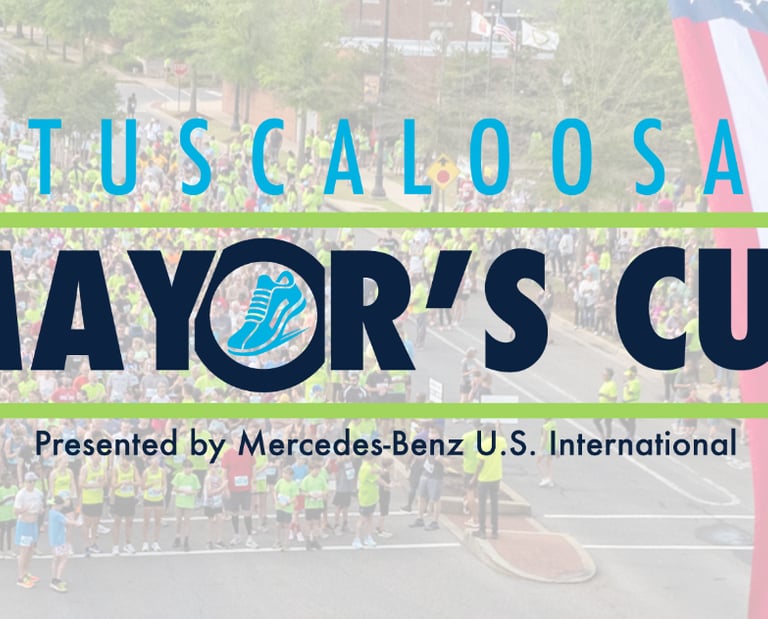 The Logo of the Tuscaloosa Mayor's Cup presented by Mercedes-Benz with a US Flag and runners