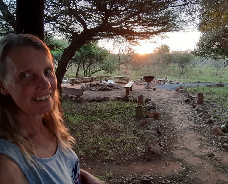 Fire pit area next to communal kitchen for the affordable glamping dome tent accommodation in Hluhluwe