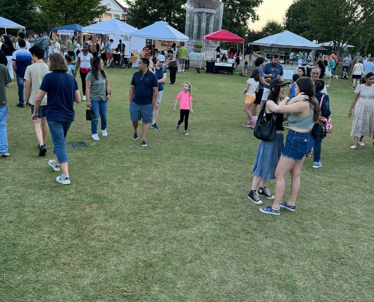 Families, kids, and community members enjoying nice weather at a market