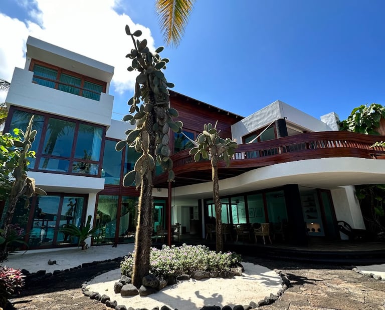 Exterior view of Villa Escalesia Galápagos, a contemporary oceanfront boutique hotel surrounded by n