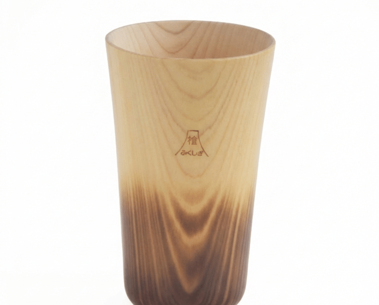 Handcrafted Japanese hinoki cypress wood tumbler with natural grain and dark charred base.