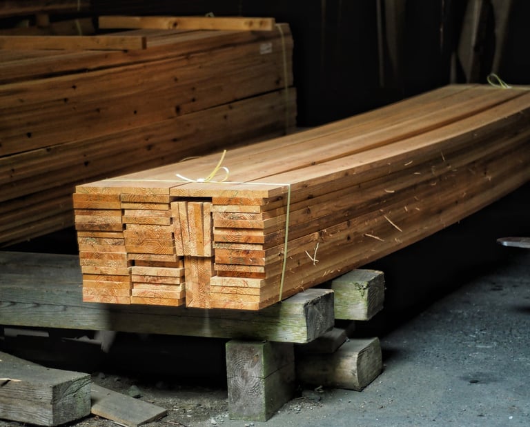 Stack of high-quality sugi cedar lumber planks tied for construction in a sawmill.