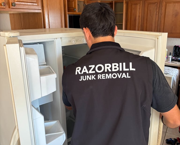 Razorbill Junk Removal removing an old refrigerator in San Antonio