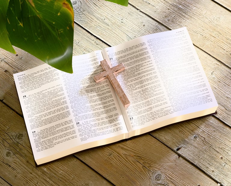 3D render of an open Bible with a wooden cross bookholder.