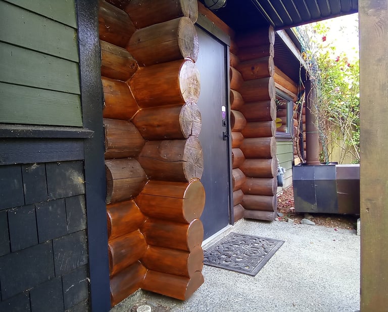log home chink and staining by Vancouver Island log house restoration company Embassy Restorations