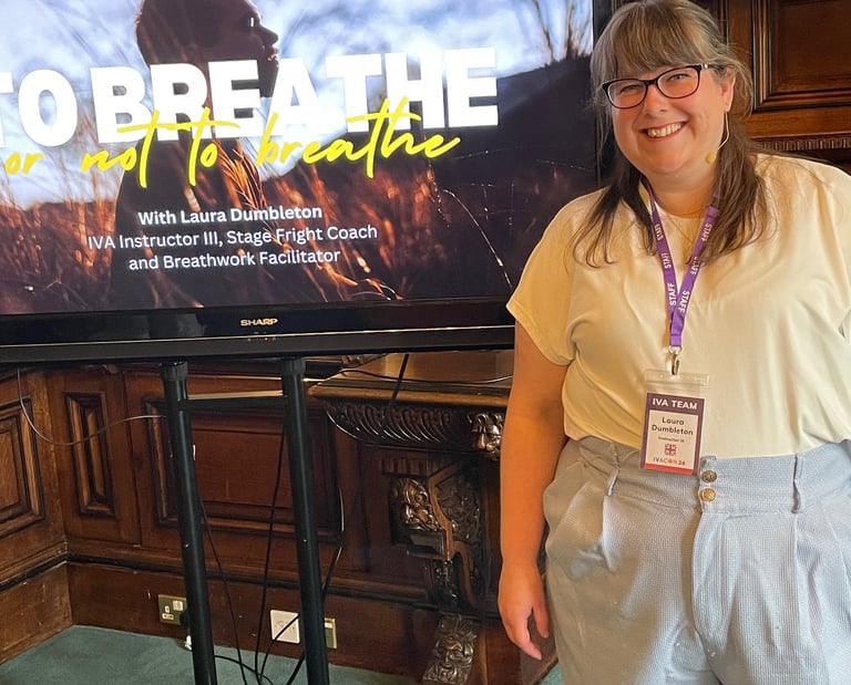 Laura Dumbleton presenting at IVACON 2024 in front of a To Breathe or Not to Breathe screen