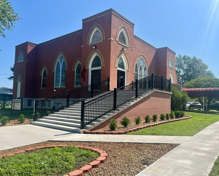 Moran United Methodist Church building new stairs, landscaping, and new sidewalk. May2023
