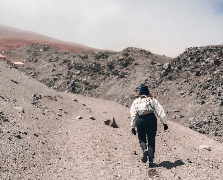 Girl hiking on the Volcano Cotopaxi in Ecuador, South America