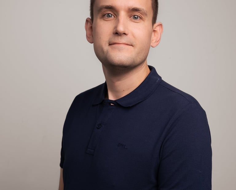 a man in a blue shirt and a white shirt
