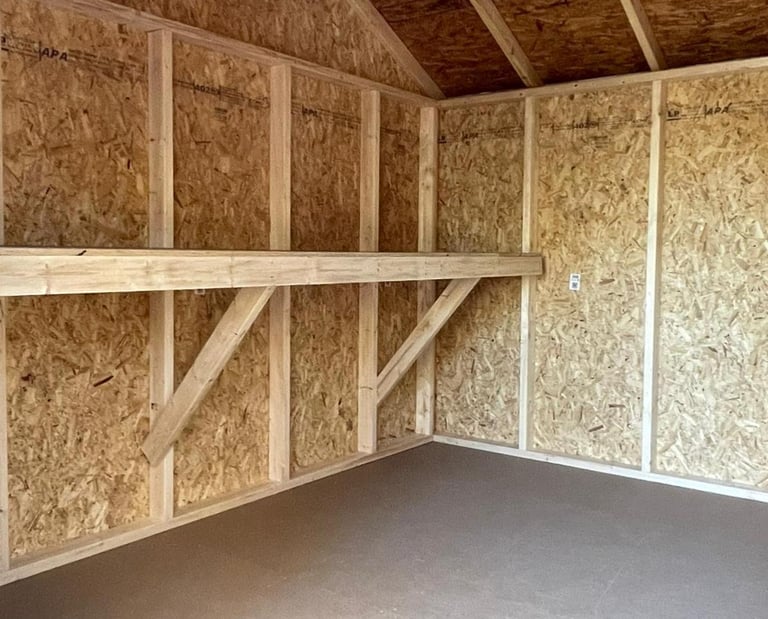 Custom shed with interior workbench built in Massachusetts and Rhode Island for added functionality.