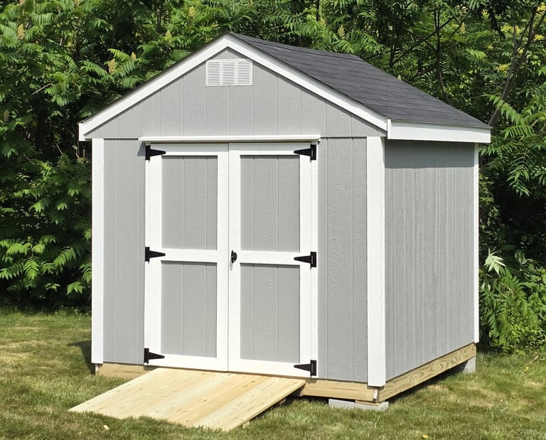 Custom wooden shed built in Massachusetts, perfect for garden tools and storage.