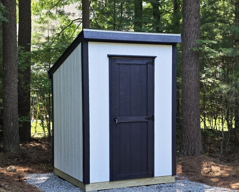 Compact 6x6 wooden storage shed with durable construction, ideal for small backyard spaces.