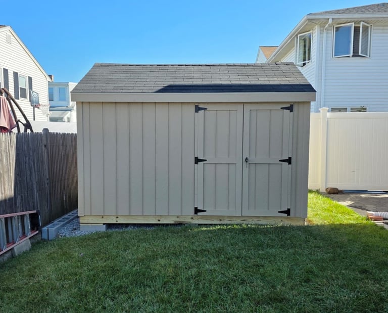 Custom 8x12 wooden shed built in Massachusetts, perfect for tools, equipment, and more.