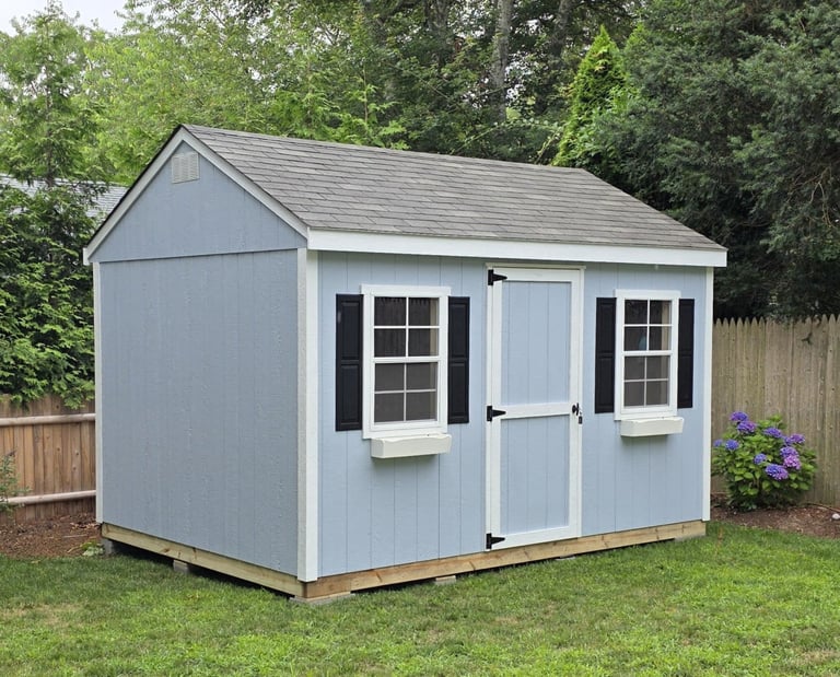 Custom painted backyard storage shed with LP SmartSide siding – professional shed painting option