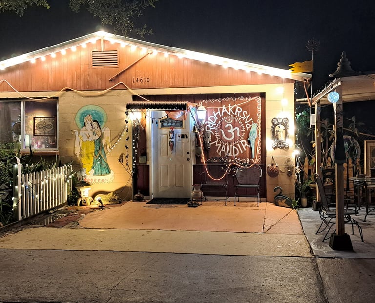 An evening photo of the exterior of the main sanctuary with Sri Sri Radha Vrndaban Chandra inside