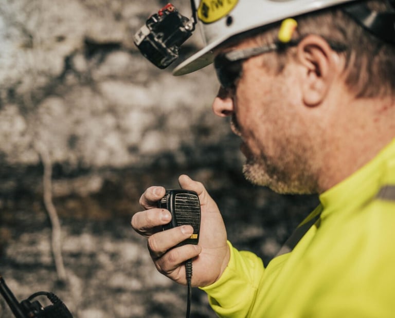 Rescue personnel using their microphone/speaker connected to their PoC device