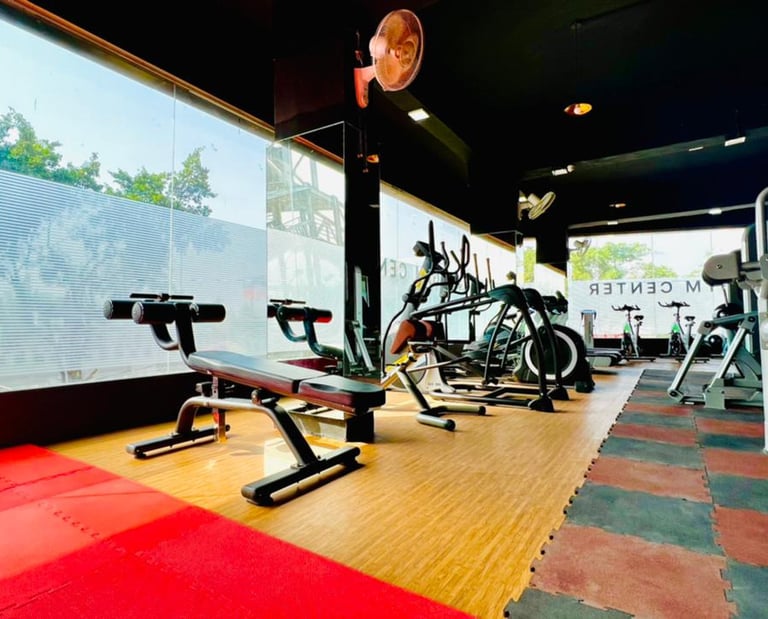 a gym room with a bench and a bench with a bench top