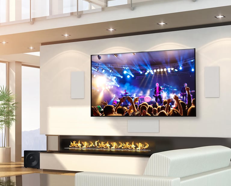 TV mounted on a wall with Home Cinema speakers in Milton Keynes. MountMyTV