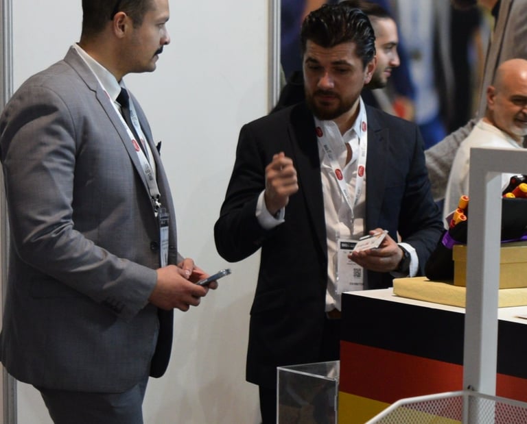a man in a suit and tie is talking to a man in a suit