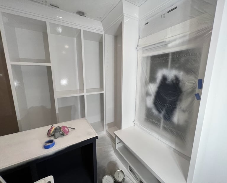 Custom refinished white built-in closet with a smooth, professional finish, enhancing storage space