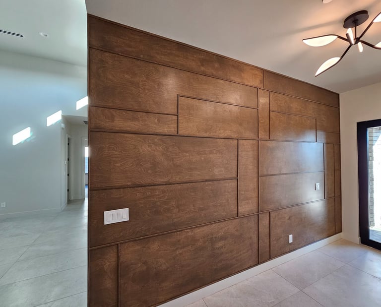 Modern accent wall with medium-tone wood trim, adding warmth and texture to a contemporary interior