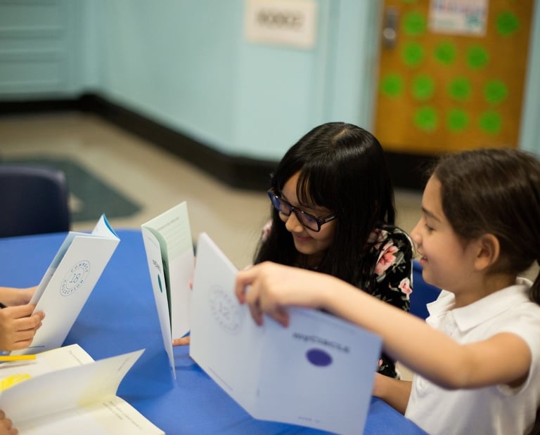 Students enjoy sharing their workbooks with each other.