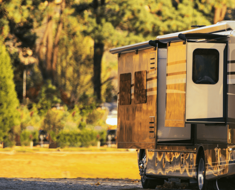 a camper trailer parked in a field