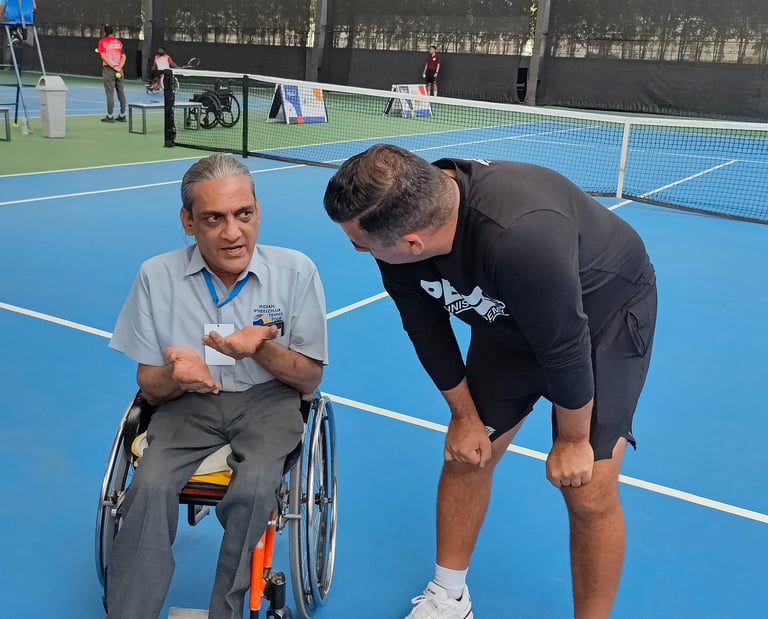 Wheelchair athletes and tennis players working wtih Cesar Performance Coach