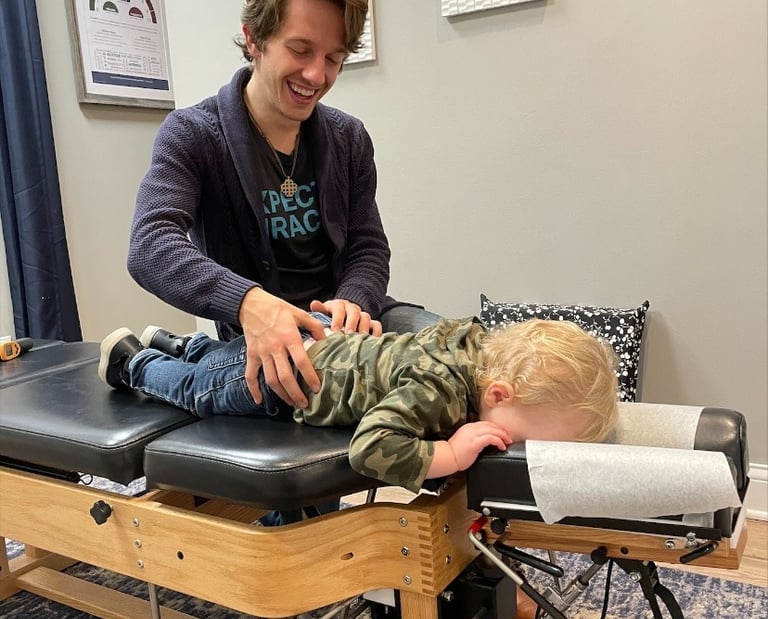 Child sleeps during their pediatric chiropractic adjustment in Franklin TN