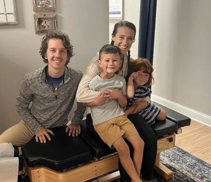 Happy family smiling after gentle chiropractic adjustment in Franklin TN