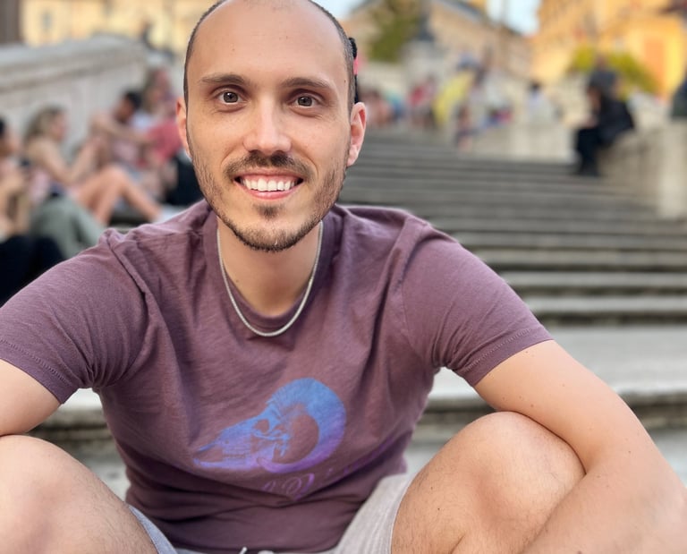 a man sitting on a staircase in front of a crowd of people