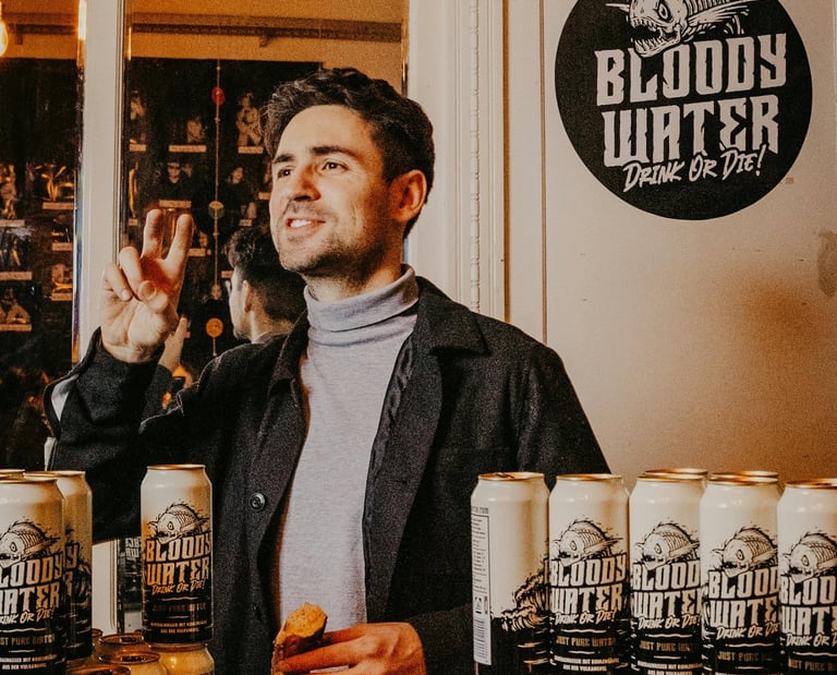 Man at a Business Launch with His Products